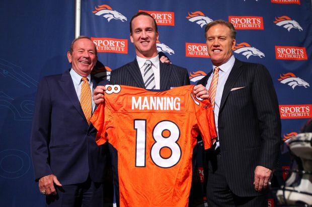 Quarterback Peyton Manning (C) poses with majority owner, president, and CEO Pat Bowlen (L) and executive vice president of football operations John Elway (R) during a news conference announcing Manning's contract with the Denver Broncos in the team meeting room at the Paul D. Bowlen Memorial Broncos Centre on March 20, 2012 in Englewood, Colorado. Manning, entering his 15th NFL season, was released by the Indianapolis Colts on March 7, 2012, where he had played his whole career. It has been reported that Manning will sign a five-year, $96 million offer. (Photo by Doug Pensinger/Getty Images)