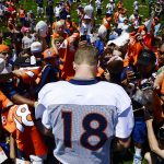 ENGLEWOOD, CO - JULY 31: Fans crowd around Denver Broncos quarterback Peyton Manning (18) as he signs autographs July 31, 2015 at Dove Valley. This was the first day of training camp for the Broncos 2015-2016 season. (Photo By Brent Lewis/The Denver Post via Getty Images)