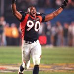 Denver Broncos player Neil Smith celebrates after the Broncos defeated the Green Bay Packers 31-24 in Super Bowl XXXII in San Diego, CA 25 January.  It was Denver's first Super Bowl victory.    AFP PHOTO/Jeff HAYNES (Photo credit should read JEFF HAYNES/AFP/Getty Images)