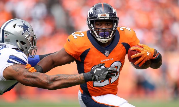 Running back C.J. Anderson #22 of the Denver Broncos rushes against the Dallas Cowboys int he first...