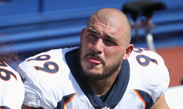 Adam Gotsis #99 of the Denver Broncos looks on from the bench during NFL game action against the Bu...