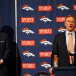Executive vice president of football operations John Elway (R) speaks as quarterback Peyton Manning stands to his right during a news conference announcing Manning's contract with the Denver Broncos in the team meeting room at the Paul D. Bowlen Memorial Broncos Centre on March 20, 2012 in Englewood, Colorado. Manning, entering his 15th NFL season, was released by the Indianapolis Colts on March 7, 2012, where he had played his whole career. It has been reported that Manning will sign a five-year, $96 million offer.  (Photo by Justin Edmonds/Getty Images)