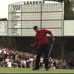 Tiger Woods of the USA celebrates after sinking a 4 feet putt to win the US Masters at Augusta, Georgia. Woods won the tournament with a record low score of 18 under par.  Mandatory Credit: Stephen Munday /Allsport