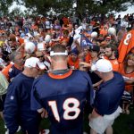 Denver Broncos QB Peyton Manning (18) signs autographs after practice on opening day of training camp July 25, 2013 at Dove Valley. (Photo By John Leyba/The Denver Post via Getty Images)
