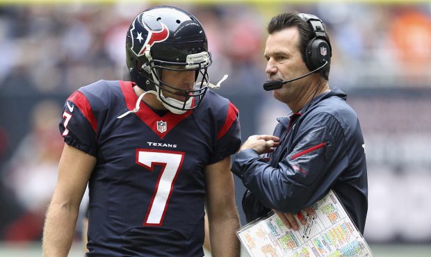 Case Keenum #7 of the Houston Texans talks with coach Gary Kubiak during the game against the New E...