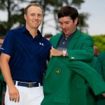 Bubba Watson presents Jordan Spieth of the United States with the green jacket after Spieth won the 2015 Masters Tournament at Augusta National Golf Club on April 12, 2015 in Augusta, Georgia.  (Photo by Jamie Squire/Getty Images)