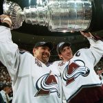 Ray Bourque #77 of the Colorado Avalanche lifts the cup with Joe Sakic #19 after the Colorado Avalanche defeated the New Jersey Devils 3-1 in game seven of the NHL Stanley Cup Finals at Pepsi Center in Denver, Colorado. The Avalanche take the series 4-3. (Photo by B Bennett/Getty Images)