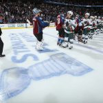Head coach Patrick Roy (L) of the Colorado Avalanche and goalie Semyon Varlamov #1 of the Colorado Avalanche line up to congratulate Zach Parise #11 and the Minnesota Wild for their overtime victory in Game Seven of the First Round of the 2014 NHL Stanley Cup Playoffs at Pepsi Center on April 30, 2014 in Denver, Colorado. The Wild defeated the Avalanche 5-4 in overtime to win the series.  (Photo by Doug Pensinger/Getty Images)