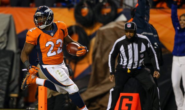 Running back CJ Anderson #22 of the Denver Broncos rushes for a 39 yard fourth quarter go-ahead tou...