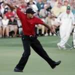 Golfer Tiger Woods of the US celebrates after making the winning putt on the 18th green 10 April 2005 during the final round of the 2005 Masters Golf Tournament at the Augusta National Golf Club in Augusta, Georgia. Woods beat fellow American Chris DiMarco in a one-hole play-off.   AFP PHOTO/Timothy A. CLARY  (Photo credit should read TIMOTHY A. CLARY/AFP/Getty Images)