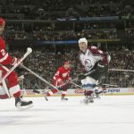 Rob Blake #4 of the Colorado Avalanche watches his goal against the Detroit Red Wings in the first period of game three of the Western Conference Finals  during the NHL Stanley Cup Playoffs at the Pepsi Center in Denver, Colorado, on May 22, 2002.  (Photo by Brian Bahr/Getty Images/NHLI)