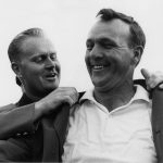 Arnold Palmer Puts On The Green Jacket With The Help Of Jack Nicklaus At The Presentation Ceremony Of The 1964 Masters Tournament  (Photo by Augusta National/Getty Images)
