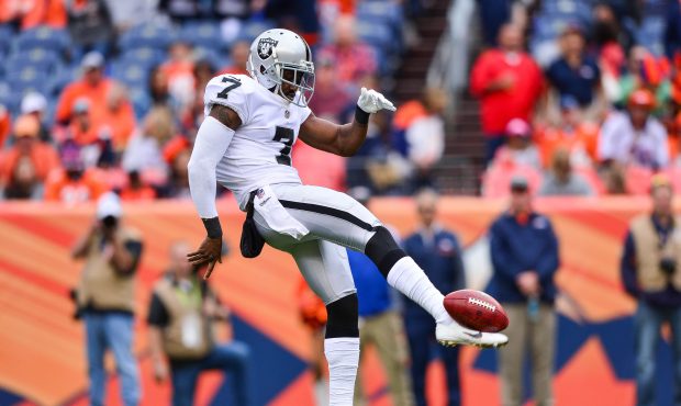 Punter Marquette King #7 of the Oakland Raiders punts against the Denver Broncos in the third quart...