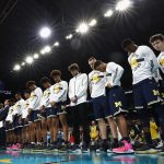 The Michigan Wolverines look on during the national anthem before the 2018 NCAA Men's Final Four National Championship game against the Villanova Wildcats at the Alamodome on April 2, 2018 in San Antonio, Texas.  (Photo by Ronald Martinez/Getty Images)