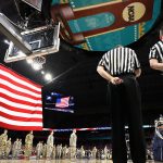 The American flag rises over the court before the 2018 NCAA Men's Final Four National Championship game between the Villanova Wildcats and the Michigan Wolverines at the Alamodome on April 2, 2018 in San Antonio, Texas.  (Photo by Ronald Martinez/Getty Images)