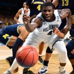 Eric Paschall #4 of the Villanova Wildcats reaches for a loose ball during the first half of the 2018 NCAA Men's Final Four National Championship game at the Alamodome on April 2, 2018 in San Antonio, Texas.  (Photo by Brett Wilhelm/NCAA Photos via Getty Images)