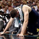 Duncan Robinson #22 of the Michigan Wolverines reacts from the sideline against the Villanova Wildcats in the first half during the 2018 NCAA Men's Final Four National Championship game at the Alamodome on April 2, 2018 in San Antonio, Texas.  (Photo by Ronald Martinez/Getty Images)