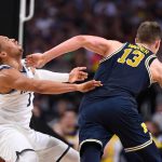 Moritz Wagner #13 of the Michigan Wolverines drives to the basket against Jalen Brunson #1 of the Villanova Wildcats during the second half of the 2018 NCAA Men's Final Four National Championship game at the Alamodome on April 2, 2018 in San Antonio, Texas.  (Photo by Jamie Schwaberow/NCAA Photos via Getty Images)