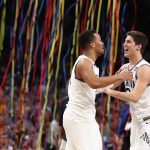 Jalen Brunson #1 and Collin Gillespie #2 of the Villanova Wildcats celebrate after defeating the Michigan Wolverines during the 2018 NCAA Men's Final Four National Championship game at the Alamodome on April 2, 2018 in San Antonio, Texas. Villanova defeated Michigan 79-62. (Photo by Ronald Martinez/Getty Images)
