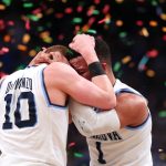 SAN ANTONIO, TX - APRIL 02:  Donte DiVincenzo #10 and Jalen Brunson #1 of the Villanova Wildcats celebrate after defeating the Michigan Wolverines during the 2018 NCAA Men's Final Four National Championship game at the Alamodome on April 2, 2018 in San Antonio, Texas. Villanova defeated Michigan 79-62.  (Photo by Tom Pennington/Getty Images)