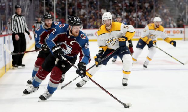 Gabriel Landeskog #92 of the Colorado Avalanche advances the puck against the Nashville Predators i...