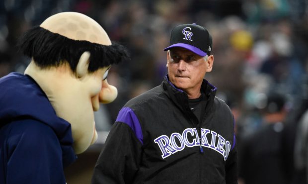 Colorado Rockies manager Bud Black walks past the San Diego Padres Swinging Friar before a baseball...