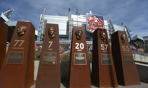 Plaques honoring members of the Denver Broncos organization stand in the Broncos Ring of Fame Plaza...