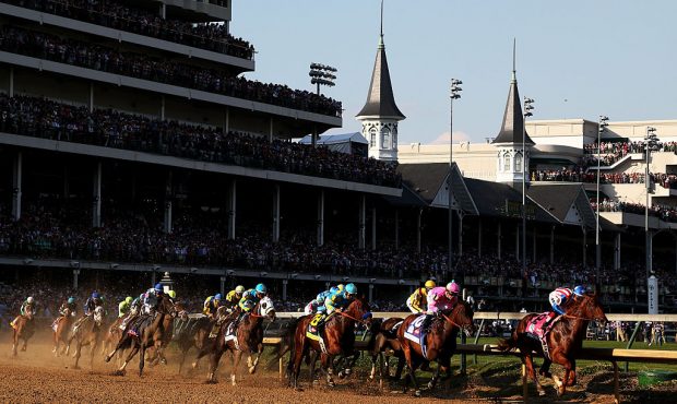 The field races through turn one at the start of the 141st running of the Kentucky Derby at Churchi...
