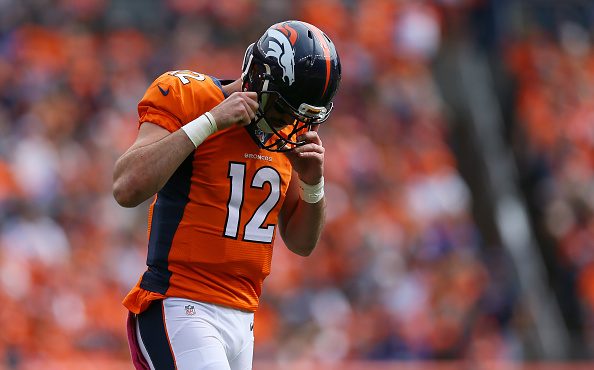 Quarterback Paxton Lynch #12 of the Denver Broncos walks off the field in the first half of the gam...