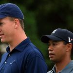 NFL player Peyton Manning waits alongside Tiger Woods on a green  during the Pro-Am prior to the start of the Quail Hollow Championship at the Quail Hollow Club on April 29, 2009 in Charlotte, North Carolina.  (Photo by Scott Halleran/Getty Images)