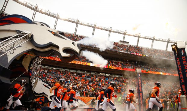 The Denver Broncos take the field before a game against the Kansas City Chiefs at Sports Authority ...
