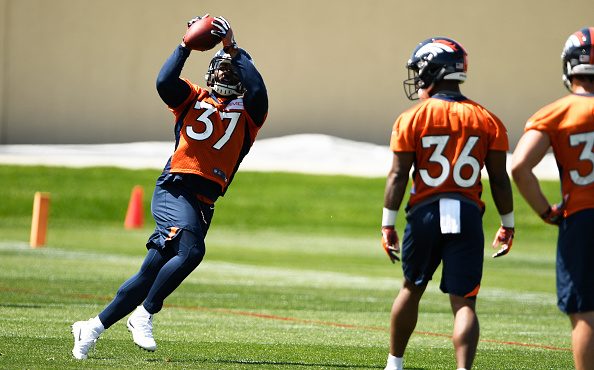 Denver Broncos running back Royce Freeman (37) pulls in a pass on the first day of Broncos OTA's at...