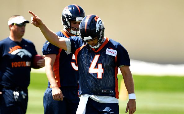 Denver Broncos quarterback Case Keenum (4) heads the team downfield on the first day of Broncos OTA...