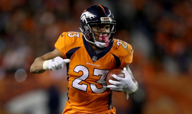 DENVER, CO - NOVEMBER 19:  Devontae Booker #23 of the Denver Broncos carries the ball against the C...