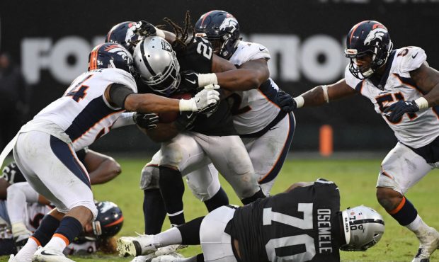 OAKLAND, CA - NOVEMBER 26:  Marshawn Lynch #24 of the Oakland Raiders rushes with the ball against ...