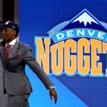 Donovan Mitchell reacts on stage after being drafted 13th overall by the Denver Nuggets during the first round of the 2017 NBA Draft at Barclays Center on June 22, 2017. (Photo by Mike Stobe/Getty Images)