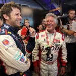 (L-R) Marco Andretti, driver of the #26 Team RC Cola Chevrolet shares a laugh with his grandfather Mario Andretti prior to the start of the IZOD IndyCar Series 96th running of the Indianapolis 500 mile race at the Indianapolis Motor Speedway on May 27, 2012 in Indianapolis, Indiana.  (Photo by Nick Laham/Getty Images)