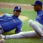 Ken Griffey Sr (L). and Ken Griffey Jr. #24 of the Seattle Mariners talk before a baseball game against the Baltimore Orioles on September 5, 1990 at Memorial Stadium in Baltimore, Maryland.  The Mariners won 9-5.  (Photo by Mitchell Layton/Getty Images)