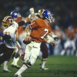 SAN DIEGO, CA - JANUARY 31: John Elway #7 of the Denver Broncos carries the ball and looks for a receiver during Super Bowl XXII against the Washington Redskins on January 31, 1988 in San Diego, California. The Redskins defeated the Broncos 41-10. (Photo by Focus on Sport/Getty Images)