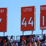 DENVER, CO - SEPTEMBER 18:  Executive vice president, general manager, and former quarterback John Elway, former halfback Floyd Little, and former quarterback Frank Tripucka's jersey numbers are retired during the pregame ceremony against the Indianapolis Colts at Sports Authority Field Field at Mile High on September 18, 2016 in Denver, Colorado. (Photo by Justin Edmonds/Getty Images)