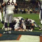 Denver Broncos Hall of Fame quarterback John Elway (7) scores a touchdown on a three-yard quarterback sneak during Super Bowl XXXIII, a 34-19 Denver Broncos victory over the Atlanta Falcons on January 31, 1999, at Pro Player Stadium in Miami, Florida. (Photo by E. Bakke/Getty Images)
