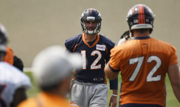 Denver Broncos quarterback Paxton Lynch (12) is warming up for the team's mandatory minicamp on Thu...