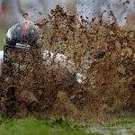ENGLEWOOD, CO - AUGUST 05:  Zane Beadles #68 of the Denver Broncos dives into the mud as rookies partake in the slip and slide fumble drill during training camp at Dove Valley on August 5, 2010 in Englewood, Colorado.  (Photo by Doug Pensinger/Getty Images)