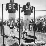MAY 8 1970, MAY 9 1970; Denver Broncos * Training Camp (New File); Rookie Camp Isn't Just Picture Day; Linebackers Bill Butler (60) of San Fernando State and Mike Kennedy of Arizona State chin themselves on the horizontal bar as Bronco coaches watch. The rookies at the camp are being ***** for both agility and strength.;  (Photo By Bill Wunsch/The Denver Post via Getty Images)
