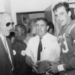 DEC 8 1966, DEC 11 1966; Coach Ray Malavasi, Goose Gonsoulin; Gonsoulin, defensive captain, presents ***** with game fall after Broncos first win of seam against Houston 40-38; Gonsoulin, Goose spts.file 5p;  (Photo By The Denver Post via Getty Images)
