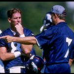 18 Jul 1997:  Quarterbacks Jeff Lewis (left) and John Elway of the Denver Broncos talk during the Broncos training camp at the University of Northern Colorado in Greeley, Colorado. Mandatory Credit: Brian Bahr  /Allsport