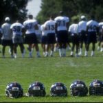 26 Jul 1998:  General view of players and helmets during the 1998 Denver Broncos training camp at the University of Northern Colorado in Greeley, Colorado. Mandatory Credit: Brian Bahr  /Allsport