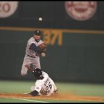 9 Jul 1996:  Chuck Knoblauch of the Minnesota Twins and the American Leage team throws the ball as Ellis Burks of the Colorado Rockies and the National League team slides into the base during the MLB All-Star Game at Veterans Stadium in Philadelphia, Penn