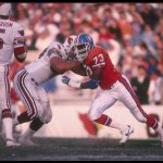 16 Dec 1989: Defensive lineman Simon Fletcher of the Denver Broncos gets blocked by a Phoenix Cardinals player during a game at Mile High Stadium in Denver, Colorado. The Broncos won the game, 37-0.