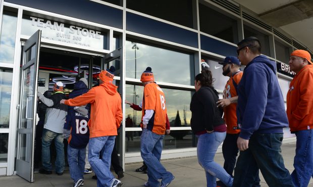 A small group of Denver Broncos fans line up in front of the Broncos Team Store when it opened at S...
